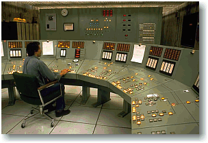 Large Control Panel Being Monitored By Operator